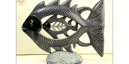 Modern Indian sculpture of a fish inside a bigger fish