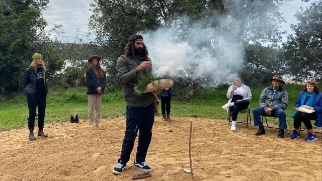 Image: Nathan Lygon from Yandama on Country shared a smoking ceremony with Sharing Stories participants on Yuin Country in June 2024.