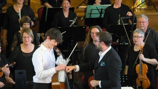 Cellist James Monro with conductor Louis Sharpe. Photo: Peter Hislop