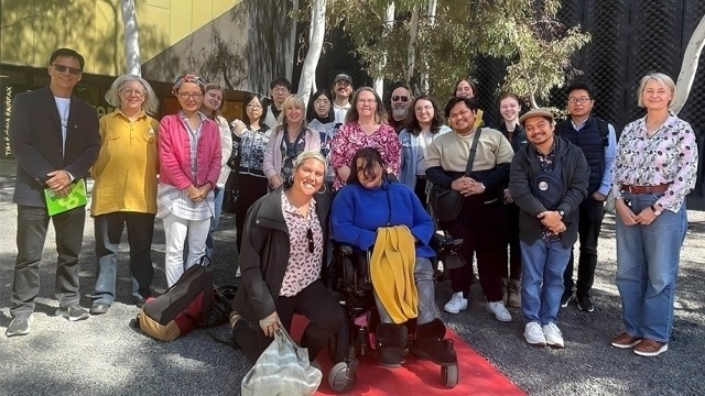 The group standing in the 'Breathing Space' installation at the National Museum’s Garden of Australian Dreams by renowned musician Genevieve Lacey.